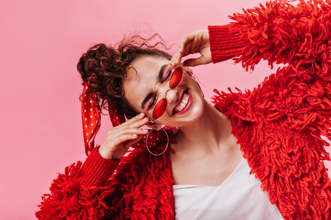 funny-woman-red-fluffy-jacket-laughing-pink-background_197531-15053.jpg