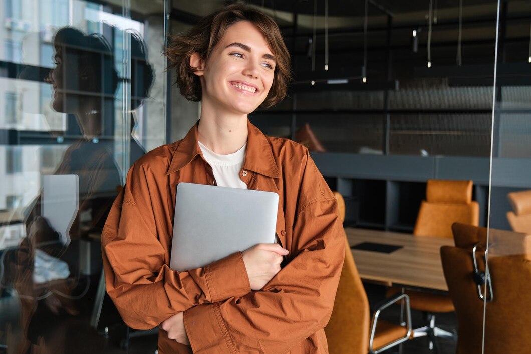 portrait-young-female-manager-office-worker-with-laptop-digital-nomad-programmer-working-her_1258-195348.jpg