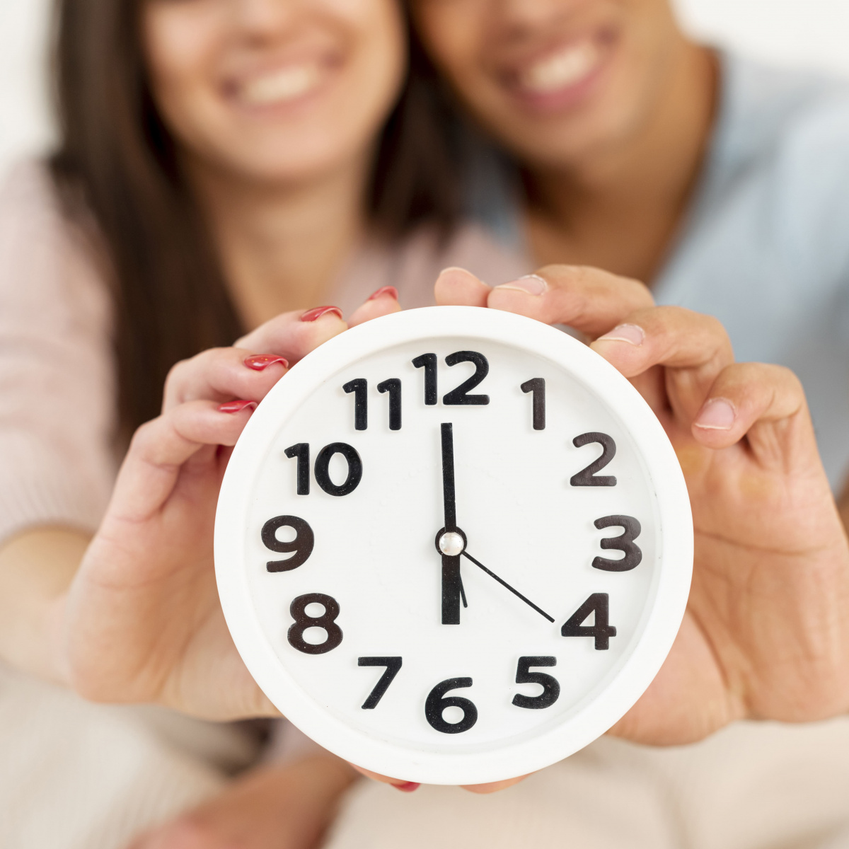 close-up-smiley-couple-with-clock.jpg