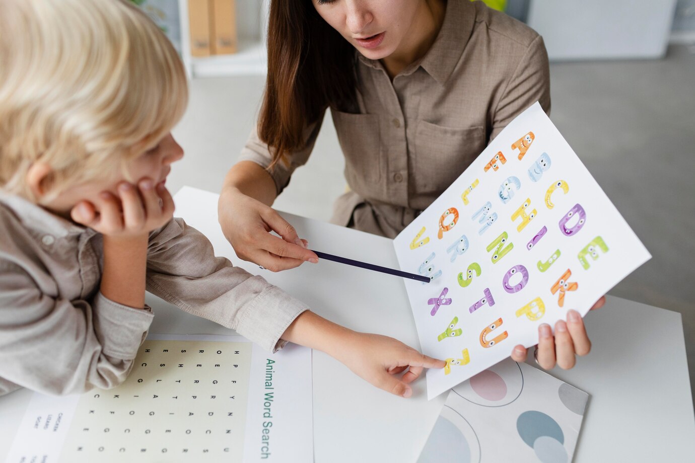 woman_doing_speech_therapy_with_a_little_boy_at_her_clinic_23_2149110236.jpg