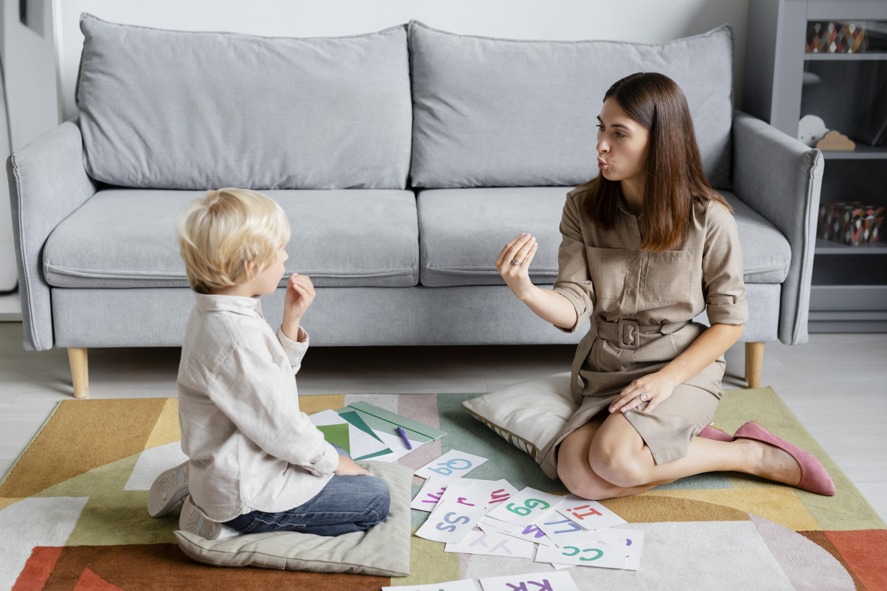 young-woman-doing-speech-therapy-with-little-blonde-boy.jpg
