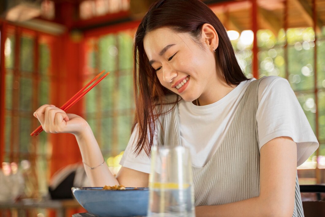 side-view-smiley-woman-holding-chopsticks_23-2149706697.jpg