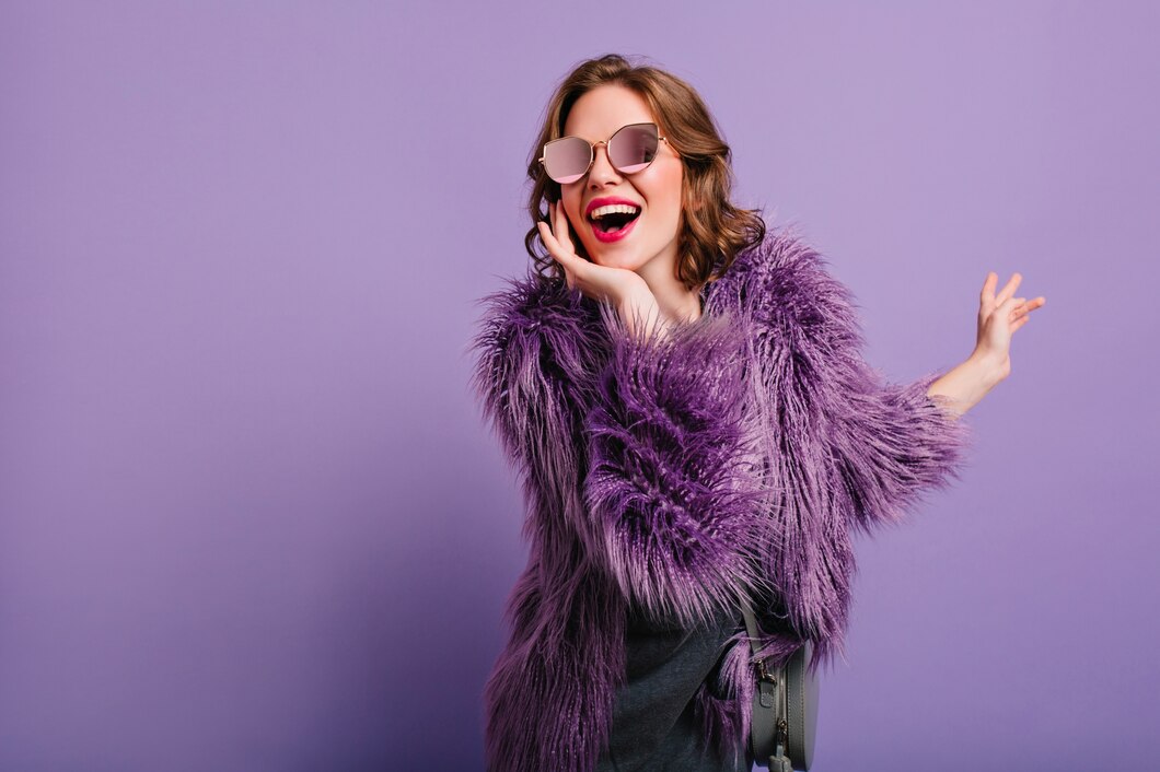 adorable-woman-expressing-true-positive-emotions-during-photoshoot-purple-fur-coat_197531-7081.jpg